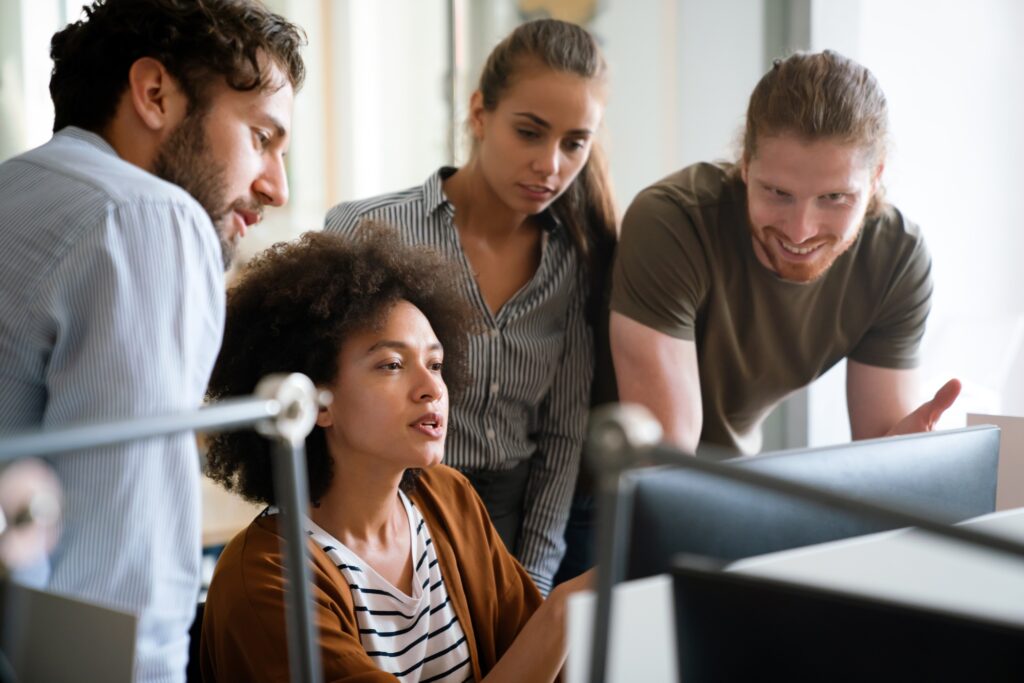 Programmers cooperating at IT company developing apps. People business work office concept